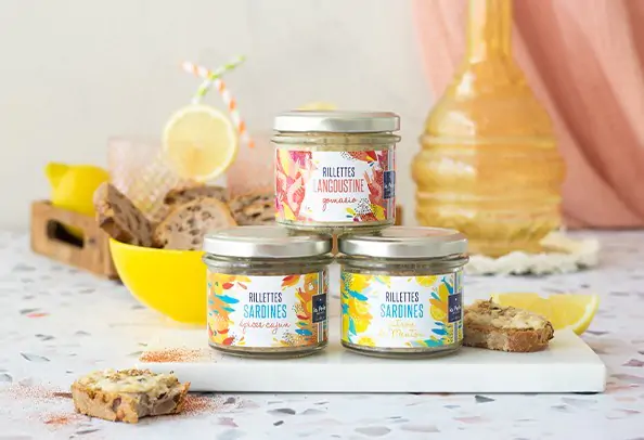 Rillettes La Perle des Dieux mariant subtilement poissons ou crustacés avec des fruits ou des épices en petit pot de verre.